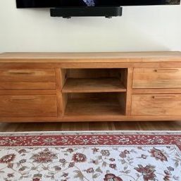 Sale Photo Thumbnail #2: Modern light wood media console featuring four drawers with integrated wooden pulls and a central open shelving unit.