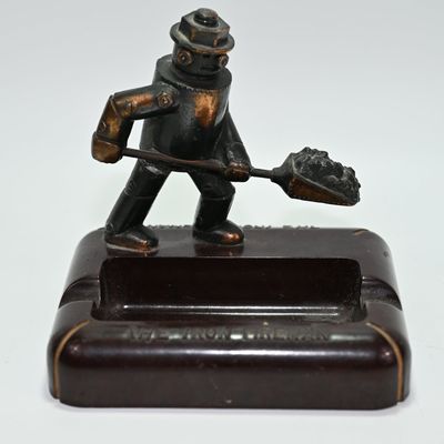 Sale Photo Thumbnail #169: Iron Fireman Ashtray w Bakelite Base - Early