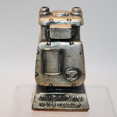 Sale Photo Thumbnail #143: American Meter Company Gas Meter Paperweight - Silver
