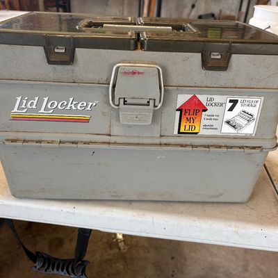 Sale Photo Thumbnail #60: Vintage Lid Locker plastic tackle box with seven levels of storage, showing some wear and dust from use.