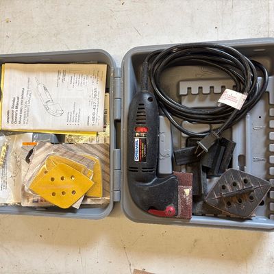 Sale Photo Thumbnail #42: Dremel Contour Sander Model 6000 kit with original carrying case, owner's manual, attachments, and sanding pads.