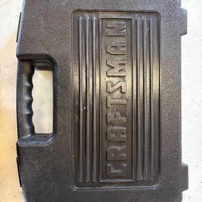Sale Photo Thumbnail #43: Black Craftsman blow-molded plastic tool carrying case with raised logo.