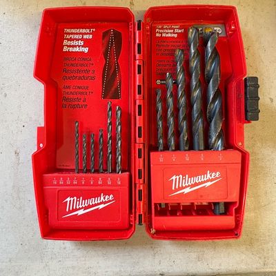 Sale Photo Thumbnail #5: Milwaukee Thunderbolt drill bit set in its original red plastic carrying case, showing some signs of light use.