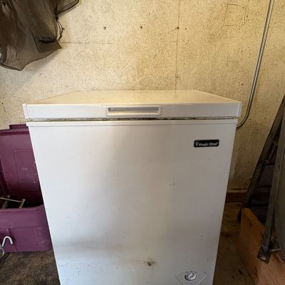 Sale Photo Thumbnail #66: White Magic Chef compact chest freezer showing surface scuffs and wear along the lid gasket.