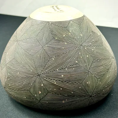 Sale Photo Thumbnail #135: Acoma Pueblo fine-line pottery bowl, signed by artist Sarah Garcia on the unpainted base.