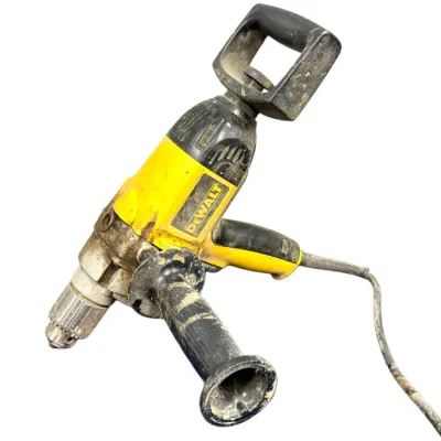 Sale Photo Thumbnail #53: Heavy-duty DeWalt corded spade handle drill featuring a side auxiliary handle and keyed chuck, showing heavy surface wear and dirt from job site use.