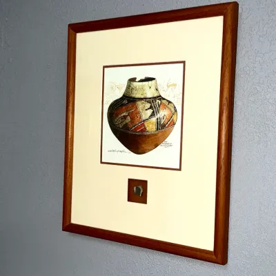 Sale Photo Thumbnail #38: Framed Southwestern print depicting a San Bernardo polychrome pot, featuring a pottery shard inset into the lower mat in a wooden frame.