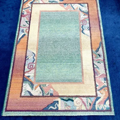 Sale Photo Thumbnail #709: Postmodern style area rug with a teal center panel and abstract geometric border in pastel and earth tones.