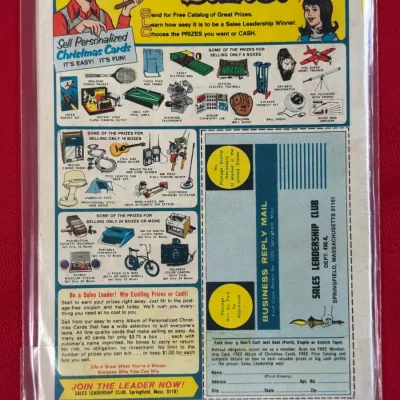 Sale Photo Thumbnail #809: Vintage comic book back cover featuring a full-page Sales Leadership Club advertisement for selling Christmas cards, housed in a protective plastic sleeve.