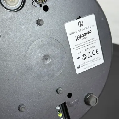 Sale Photo Thumbnail #841: Underside of a Storz & Bickel Volcano Classic vaporizer showing rubber feet, serial number, and product specifications label.