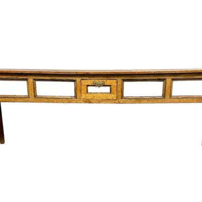 Sale Photo Thumbnail #16: Antique wooden sofa table or shop counter with glass-front paneling and a center drawer featuring a metal label pull.
