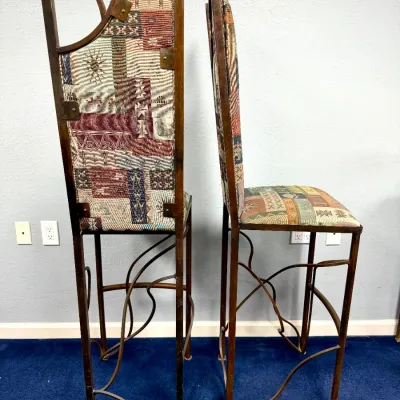 Sale Photo Thumbnail #309: Pair of high-backed wrought iron barstools with Southwestern-style tapestry fabric upholstery and sculptural curved bases.