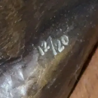 Sale Photo Thumbnail #118: Close-up detail showing the edition numbering '12/20' inscribed on a bronze or cast metal sculpture.