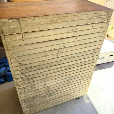 Sale Photo Thumbnail #272: Tall vintage wooden multi-drawer storage cabinet featuring shallow slatted drawers, ideal for map, plan, or blueprint organization.