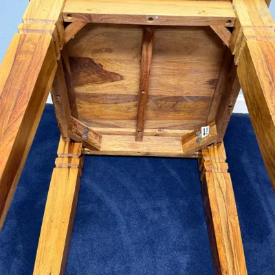 Sale Photo Thumbnail #739: Underside view of a solid sheesham wood end table showing corner bracing, sturdy leg construction, and natural wood grain.