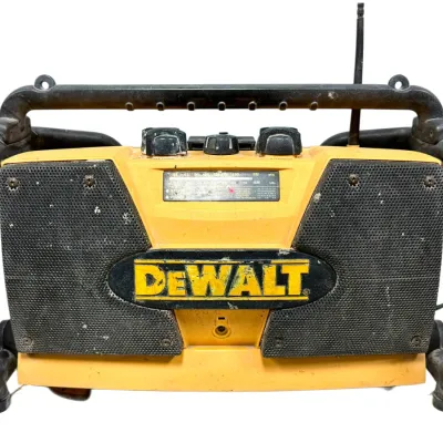 Sale Photo Thumbnail #97: Vintage DeWalt heavy-duty jobsite AM/FM radio player with integrated roll cage frame, showing typical wear and scuffs from use.