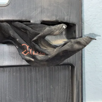 Sale Photo Thumbnail #627: Black fabric dust bag with red graphic tucked into a molded dark grey plastic storage tray.