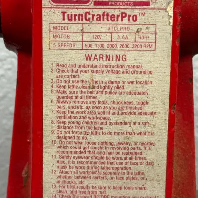 Sale Photo Thumbnail #555: Manufacturer and specification label for a PSI Woodworking TurnCrafter Pro woodworking lathe, model #TCLPRO.