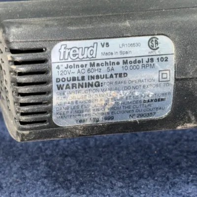 Sale Photo Thumbnail #625: Freud Model JS 102 4-inch joiner machine with double-insulated black casing, manufactured in 1999.