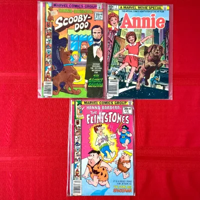 Sale Photo Thumbnail #76: Group of three vintage Marvel comic books, including Scooby-Doo #2, A Marvel Movie Special Annie #1, and The Flintstones #4, all individually bagged.