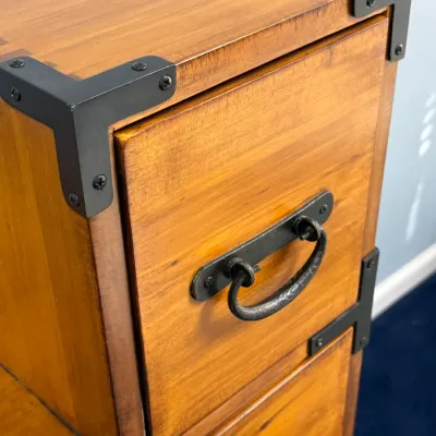 Sale Photo Thumbnail #206: Japanese-style step chest featuring light wood finish with black metal corner brackets and bail handles.