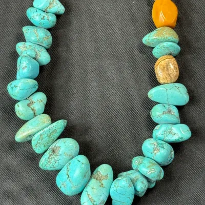 Sale Photo Thumbnail #355: Southwestern-style beaded necklace featuring natural turquoise nuggets interspersed with varied polished stone beads.