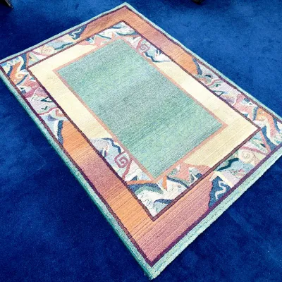 Sale Photo Thumbnail #708: Postmodern area rug featuring a sage green central field framed by pastel abstract and geometric border designs.