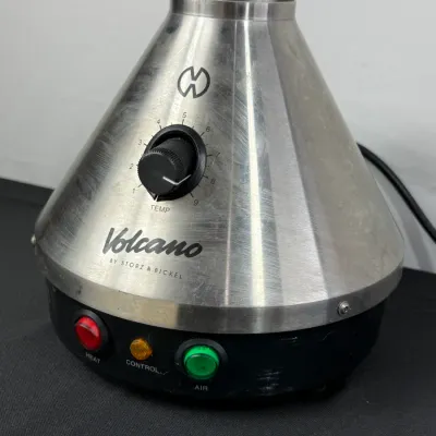 Sale Photo Thumbnail #839: Volcano Classic desktop vaporizer by Storz & Bickel with brushed stainless steel cone, temperature dial, and illuminated heat/air switches.
