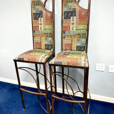 Sale Photo Thumbnail #301: Pair of Southwest style high-back metal bar stools with upholstered tapestry seats featuring Kokopelli and tribal motifs.