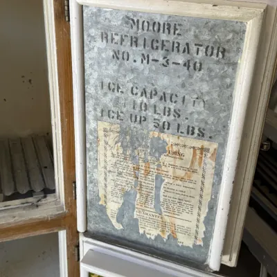 Sale Photo Thumbnail #268: Vintage Moore Refrigerator No. M-3-40 icebox with a galvanized metal liner and stencil labeling. Features original usage instructions and guarantee label attached inside the open door.
