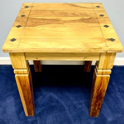 Sale Photo Thumbnail #732: Rustic solid wood end table featuring dark diamond inlays along the outer top edges and sturdy block legs.