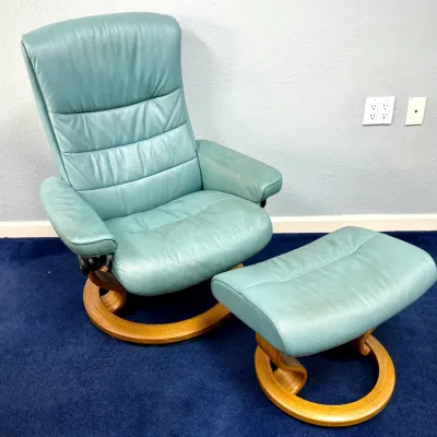 Sale Photo Thumbnail #221: Ekornes Stressless reclining armchair and matching ottoman in teal leather with a bentwood oak base.