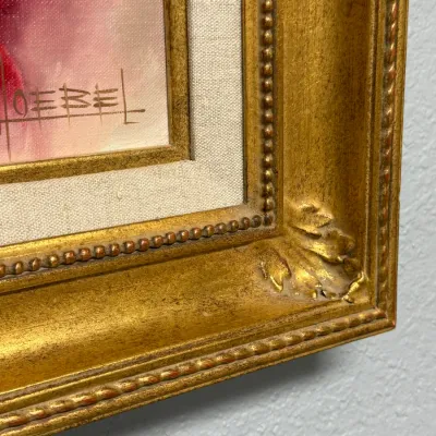 Sale Photo Thumbnail #156: Close-up of an artist signature on an oil painting, set within a linen liner and an ornate gilded wood frame.