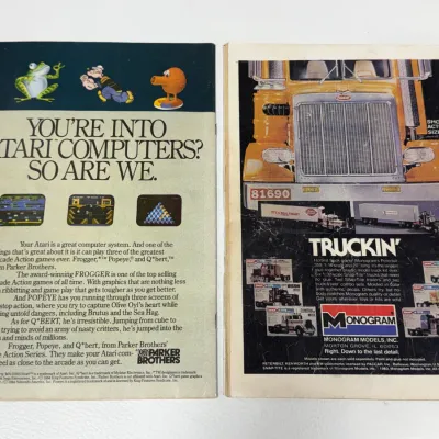 Sale Photo Thumbnail #743: Pair of vintage comic books shown from the back cover, featuring 1980s advertisements for Parker Brothers Atari games and Monogram truck model kits.