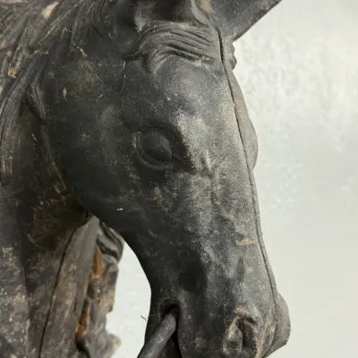 Sale Photo Thumbnail #651: Vintage cast iron horse head hitching post topper featuring a dark patinated finish and a metal ring in its mouth.