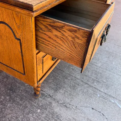 Sale Photo Thumbnail #260: Vintage oak desk or dresser featuring open drawers, decorative trim details, and twisted spiral legs.