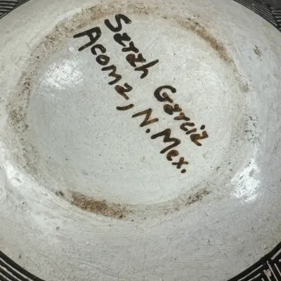 Sale Photo Thumbnail #136: Hand-signed bottom mark on an Acoma Pueblo pottery vessel, reading 'Sarah Garcia / Acoma, N. Mex.'