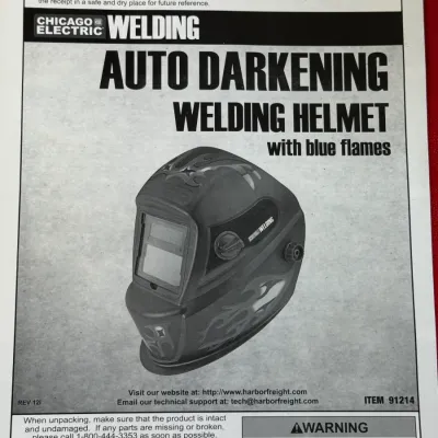 Sale Photo Thumbnail #521: Chicago Electric auto-darkening welding helmet owner's manual with blue flames graphic, item number 91214, copyright 2010.