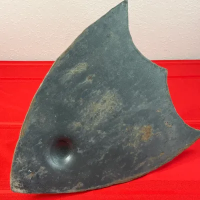Sale Photo Thumbnail #417: Vintage fish-shaped cast iron sad iron trivet or stand, featuring a dark patina with light rust spots.