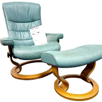 Sale Photo Thumbnail #12: Ekornes Stressless reclining armchair and matching ottoman in teal blue leather with bentwood bases.