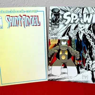 Sale Photo Thumbnail #805: Two 1990s Image Comics, including Saint Angel #1 blank sketchbook variant and Spawn #10.