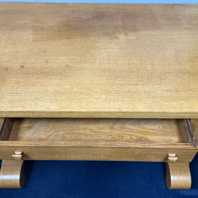 Sale Photo Thumbnail #685: Vintage light oak desk or console table featuring a single open drawer and scrolled legs.