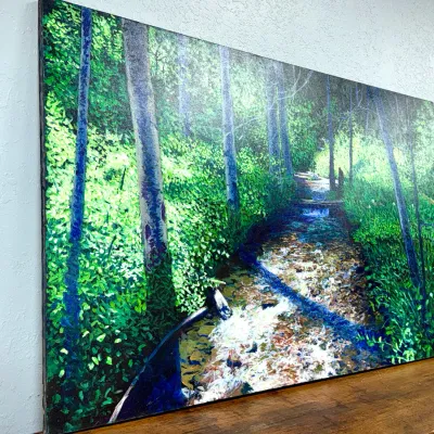 Sale Photo Thumbnail #471: Large unframed canvas painting depicting a sunlit forest stream surrounded by lush green trees and foliage.