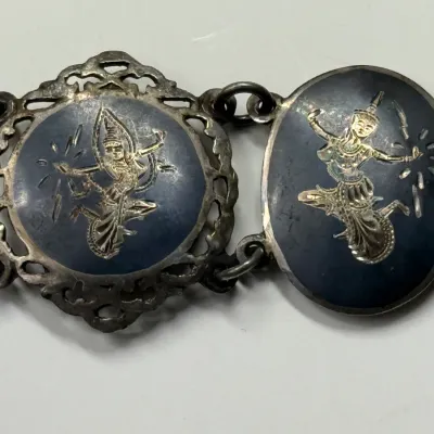 Sale Photo Thumbnail #165: Vintage Siam sterling silver and black niello bracelet featuring etched depictions of Mekkala and Ramasoon.