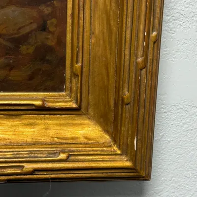 Sale Photo Thumbnail #110: Close-up detail of a vintage giltwood picture frame housing an oil painting, showing minor surface wear.