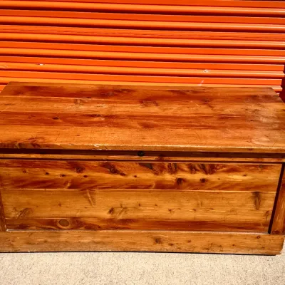 Sale Photo Thumbnail #318: Rustic knotty pine storage chest with a hinged top lid, showing light surface wear.