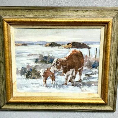 Sale Photo Thumbnail #444: Framed oil painting on canvas depicting a cow and calf in a snowy landscape, signed in the lower right, housed in a ornate gilded and painted wood frame.