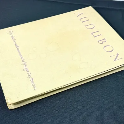 Sale Photo Thumbnail #431: Vintage clothbound art book titled Audubon, Fifty Selections with Commentaries by Roger Tory Peterson, featuring some light staining on the cream cover.