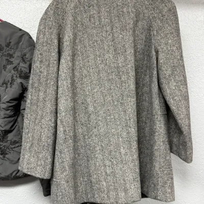Sale Photo Thumbnail #906: Vintage gray herringbone tweed wool jacket shown hanging from the back.