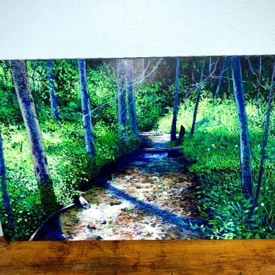 Sale Photo Thumbnail #472: Large unframed canvas landscape painting depicting a sunlit woodland stream surrounded by lush green foliage and trees.